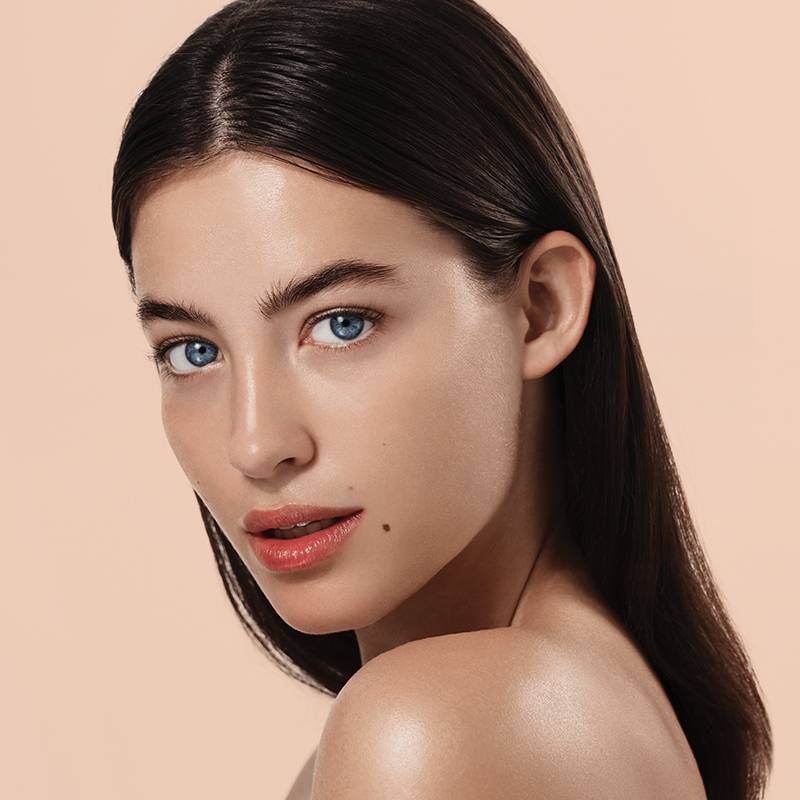 A smiling individual with beautiful, rejuvenated skin; text features a limited-time discount on a skin treatment at Springs Dermatology MD.