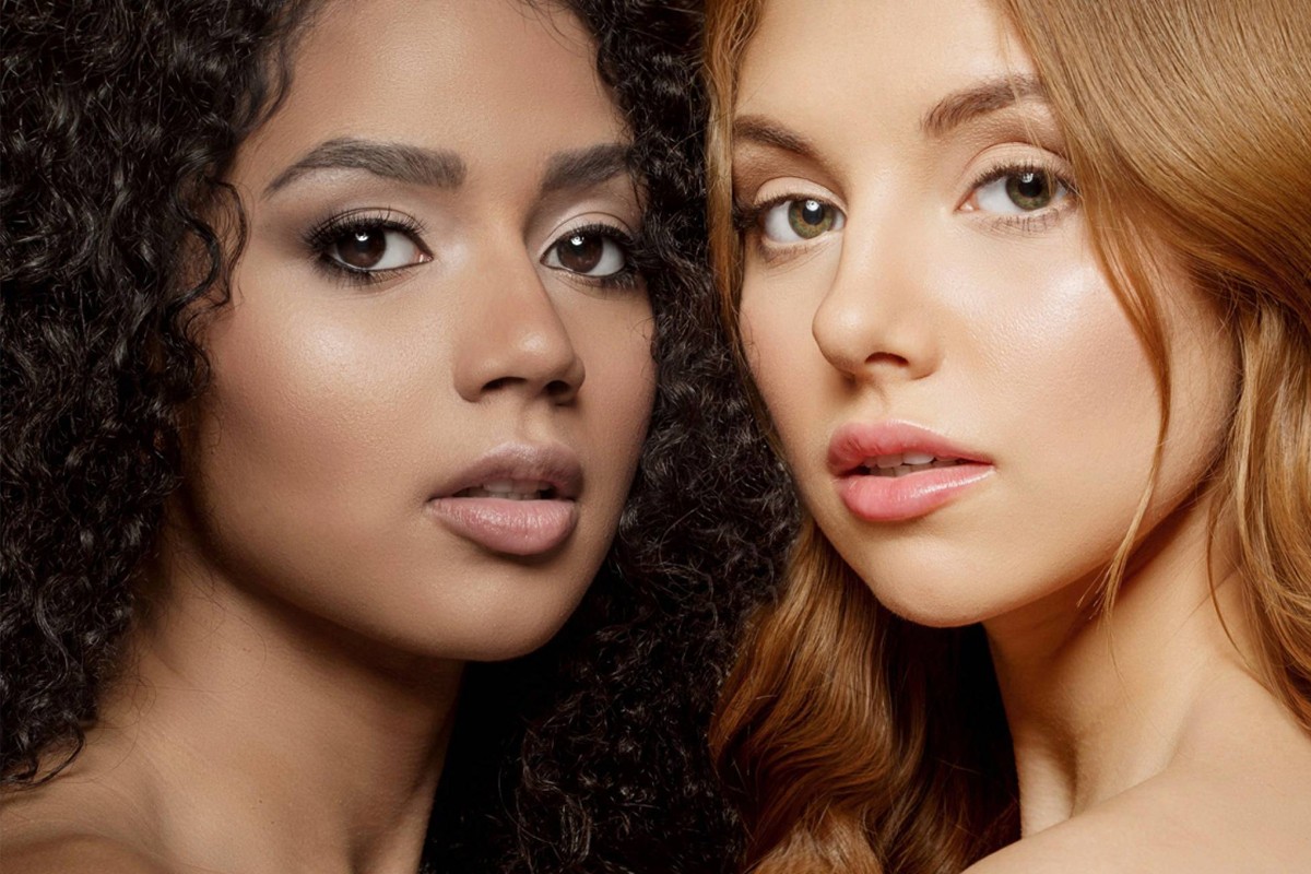 Two women with different skin tones—one fair, one dark—showing healthy, radiant complexions.